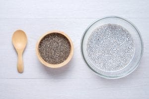 Chia seeds in bowl and soaked chia pudding.