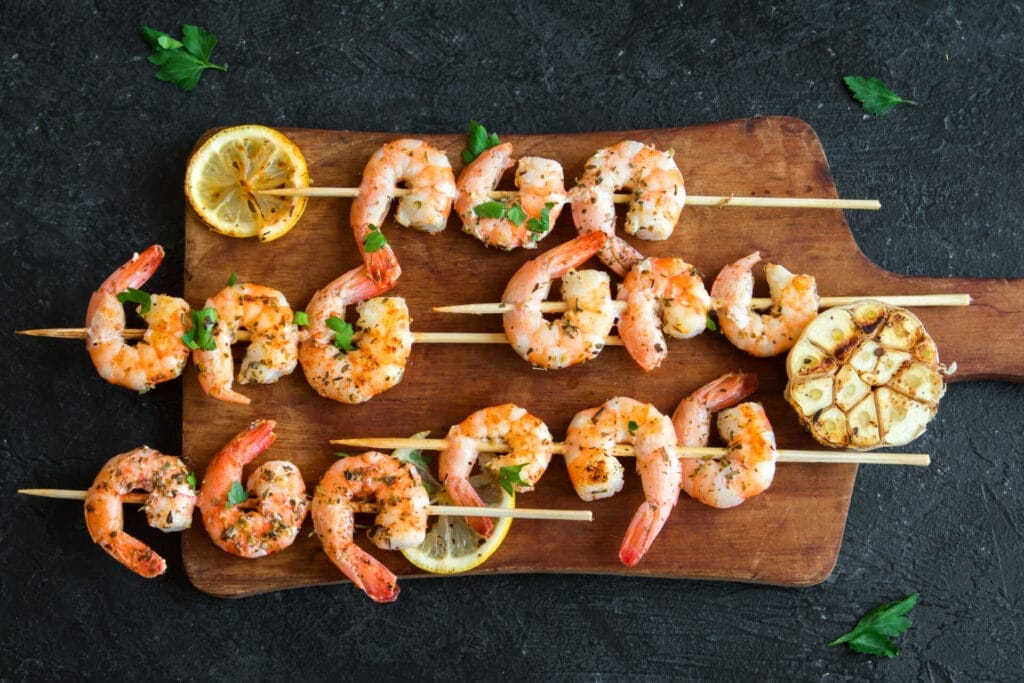 Grilled shrimp skewers with lemon and garlic.
