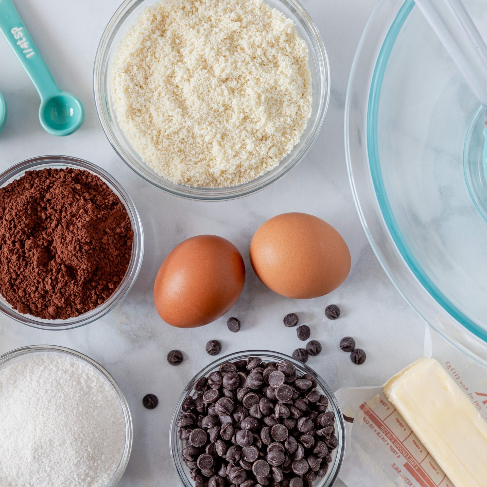 Ingredients and tools to make keto chocolate chip brownies shot from above